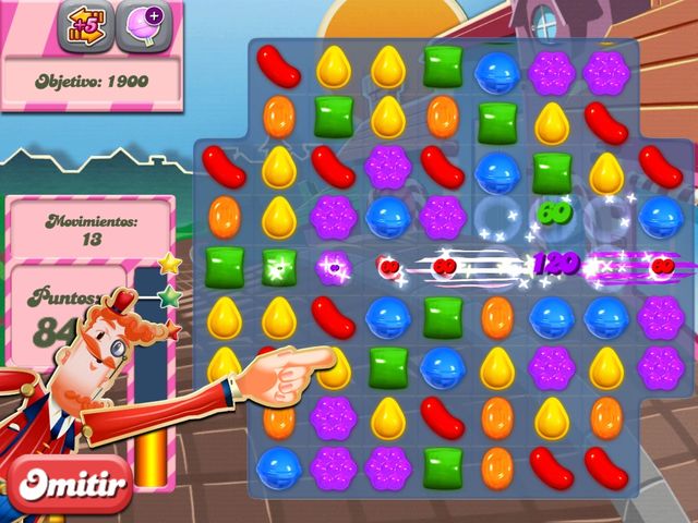 Nivel 2 de candy crush. Es tutoríal mostrando lo que pasa si unimos el caramelo rayado. Ocurre una explosión ya sea en línea recta. Se lleva todos los caramelos de esa línea.